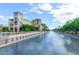 Picturesque canal view with building architecture and lush landscaping on a sunny day at 4620 N 68Th St # 116, Scottsdale, AZ 85251