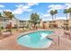 Community pool surrounded by lounge chairs and tropical landscaping at 4620 N 68Th St # 116, Scottsdale, AZ 85251