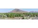 Scenic view of a nearby mountain overlooking a neighborhood, river, and desert landscape at 4620 N 68Th St # 116, Scottsdale, AZ 85251