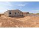 Spacious backyard featuring dirt landscaping and block wall, offering privacy and potential for customization at 4821 S 12Th St, Phoenix, AZ 85040