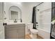 Bathroom vanity with drawers, arched mirror and shower at 4821 S 12Th St, Phoenix, AZ 85040