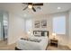 Bright bedroom showcasing a ceiling fan, plush bedding, and a tranquil atmosphere for relaxation at 4821 S 12Th St, Phoenix, AZ 85040