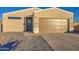 Single-story home featuring modern design, two-car garage, and low-maintenance gravel landscaping at 4821 S 12Th St, Phoenix, AZ 85040