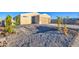 Inviting home with modern exterior, featuring a spacious driveway, gravel yard, and drought tolerant vegetation at 4821 S 12Th St, Phoenix, AZ 85040