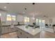 Stylish kitchen featuring a spacious island, sleek countertops, and an open layout connecting to the living spaces at 4821 S 12Th St, Phoenix, AZ 85040