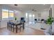 Inviting living room featuring modern decor, hardwood floors, and ample natural light from large windows at 4821 S 12Th St, Phoenix, AZ 85040