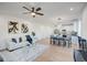 Spacious open-concept living room featuring a modern sofa, dining area, and stylish kitchen at 4821 S 12Th St, Phoenix, AZ 85040