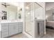 Bathroom featuring vanity with drawers and a glass-enclosed walk-in shower at 4887 N 184Th Ln, Goodyear, AZ 85395