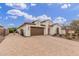 Beautiful one story home with well kept landscaping and a large brick paved drive at 4887 N 184Th Ln, Goodyear, AZ 85395