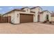 Beautful single story with brick paved drive, two car garage and desert landscape at 4887 N 184Th Ln, Goodyear, AZ 85395