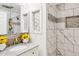 Modern bathroom featuring white marble-like tile in the shower with a glass door and granite countertops at 50880 W Val Vista Rd, Maricopa, AZ 85139