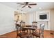 Dining room with wood floors, chandelier, table with four chairs and pass through to the kitchen at 50880 W Val Vista Rd, Maricopa, AZ 85139