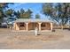 Single-story home featuring stucco walls, a covered porch with arched columns, and desert landscaping at 50880 W Val Vista Rd, Maricopa, AZ 85139