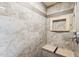 Shower boasts neutral tile with a niche and built in bench at 50880 W Val Vista Rd, Maricopa, AZ 85139