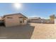 This home boasts a low-maintenance gravel backyard with a privacy wall, perfect for desert living at 6042 W Warner St, Phoenix, AZ 85043