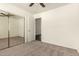 Comfortable bedroom featuring carpeted floors and a mirrored closet at 6042 W Warner St, Phoenix, AZ 85043