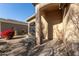 Welcoming front entrance of home, featuring a covered porch and neat desert landscaping at 6042 W Warner St, Phoenix, AZ 85043