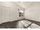 Bright living room with modern dark tile flooring, a neutral palette, and natural light at 6042 W Warner St, Phoenix, AZ 85043