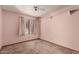 Bedroom featuring carpet flooring, a window and peach painted walls and white trim at 614 W Mcnair St, Chandler, AZ 85225