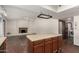 View of kitchen island leading to large living space with fireplace at 614 W Mcnair St, Chandler, AZ 85225