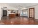 Open-concept living room with tile flooring that connects to the kitchen at 614 W Mcnair St, Chandler, AZ 85225