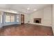 Spacious living room with fireplace, Saltillo floors and a bay window at 614 W Mcnair St, Chandler, AZ 85225