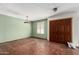 Empty living room featuring Saltillo tile floors and a large window at 614 W Mcnair St, Chandler, AZ 85225