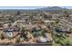 Neighborhood aerial view showcasing houses with backyard pools and landscaping, with mountains in the distance at 6420 E Gary Rd, Scottsdale, AZ 85254