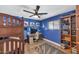 A blue bedroom with a desk and shelves at 6420 E Gary Rd, Scottsdale, AZ 85254