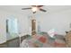 This bright bedroom has a quilt-patterned bedspread and arched doorway at 6420 E Gary Rd, Scottsdale, AZ 85254