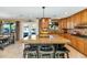 Kitchen featuring a large island with seating and a view to the backyard at 6420 E Gary Rd, Scottsdale, AZ 85254