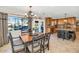 Bright kitchen with stainless appliances, granite counters, and an adjacent dining area at 6420 E Gary Rd, Scottsdale, AZ 85254