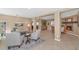 Bright, open living room with a neutral color scheme and tile flooring throughout the living and dining areas at 6420 E Gary Rd, Scottsdale, AZ 85254