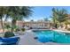 Stunning pool with adjacent outdoor kitchen and lush landscaping at 6420 E Gary Rd, Scottsdale, AZ 85254