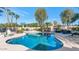 Sparkling pool with lush landscaping, seating, and a sunny patio at 6420 E Gary Rd, Scottsdale, AZ 85254