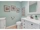 Charming powder room with decorative wall art and updated vanity at 6420 E Gary Rd, Scottsdale, AZ 85254