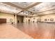 A spacious ballroom featuring wood flooring and stage lighting at 674 S 231St Dr, Buckeye, AZ 85326