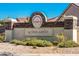 Community entrance sign for Sundance Active Adult community, featuring well-maintained landscaping at 674 S 231St Dr, Buckeye, AZ 85326