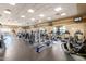 A spacious gym featuring multiple exercise machines and wall-mounted TVs at 674 S 231St Dr, Buckeye, AZ 85326