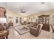 Comfortable living room with plush sofas, elegant rug, and glass doors to the outside at 674 S 231St Dr, Buckeye, AZ 85326