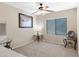 Bright bedroom with large window, ceiling fan, and neutral color scheme at 705 W Queen Creek Rd # 2006, Chandler, AZ 85248