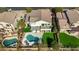 Aerial view of home with backyard featuring a pool, spa, patio, and well-manicured lawn at 7357 E Rochelle Cir, Mesa, AZ 85207