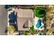 The property is an aerial view of a backyard pool area with a covered patio and lush green landscaping at 7357 E Rochelle Cir, Mesa, AZ 85207