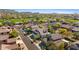 Aerial view of houses in a neighborhood near a golf course showing mountain views at 7357 E Rochelle Cir, Mesa, AZ 85207