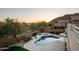 Aerial view of a serene backyard featuring a pool, spa, and lush landscaping, creating a private oasis at 7357 E Rochelle Cir, Mesa, AZ 85207