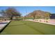 Enjoy a game of bocce ball on this well-kept court with scenic mountain backdrop and community park at 7357 E Rochelle Cir, Mesa, AZ 85207