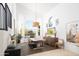 Inviting dining area with views of the pool and a modern chandelier adding elegance at 7357 E Rochelle Cir, Mesa, AZ 85207