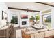 Cozy living room with fireplace, comfortable seating, and mountain views from the large windows at 7357 E Rochelle Cir, Mesa, AZ 85207