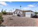 Low maintenance backyard with rock landscaping and mature palm trees at 7807 E Main St # Cc-84, Mesa, AZ 85207