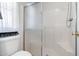 Clean, updated bathroom showcasing an all-white walk-in shower with glass doors at 7807 E Main St # Cc-84, Mesa, AZ 85207